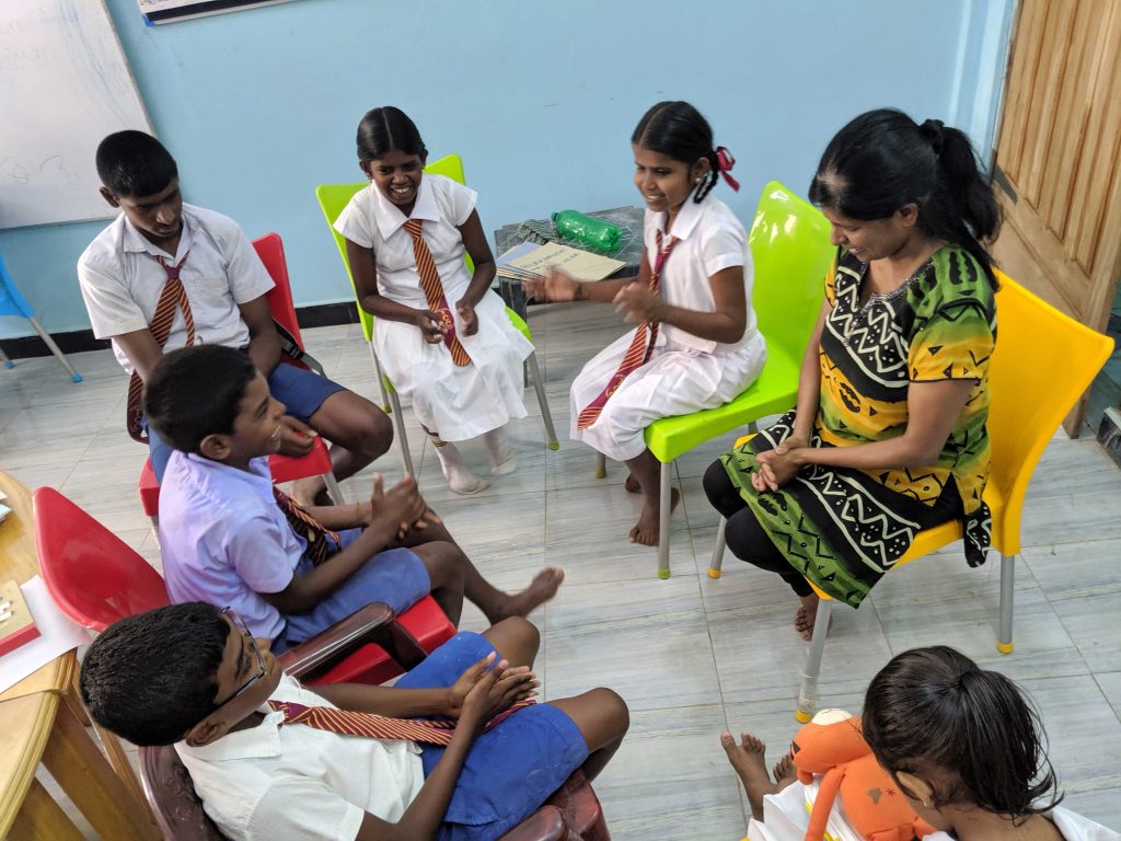 Geetha Moorthy teaches a group of young children in Killinochi, Sri Lanka.