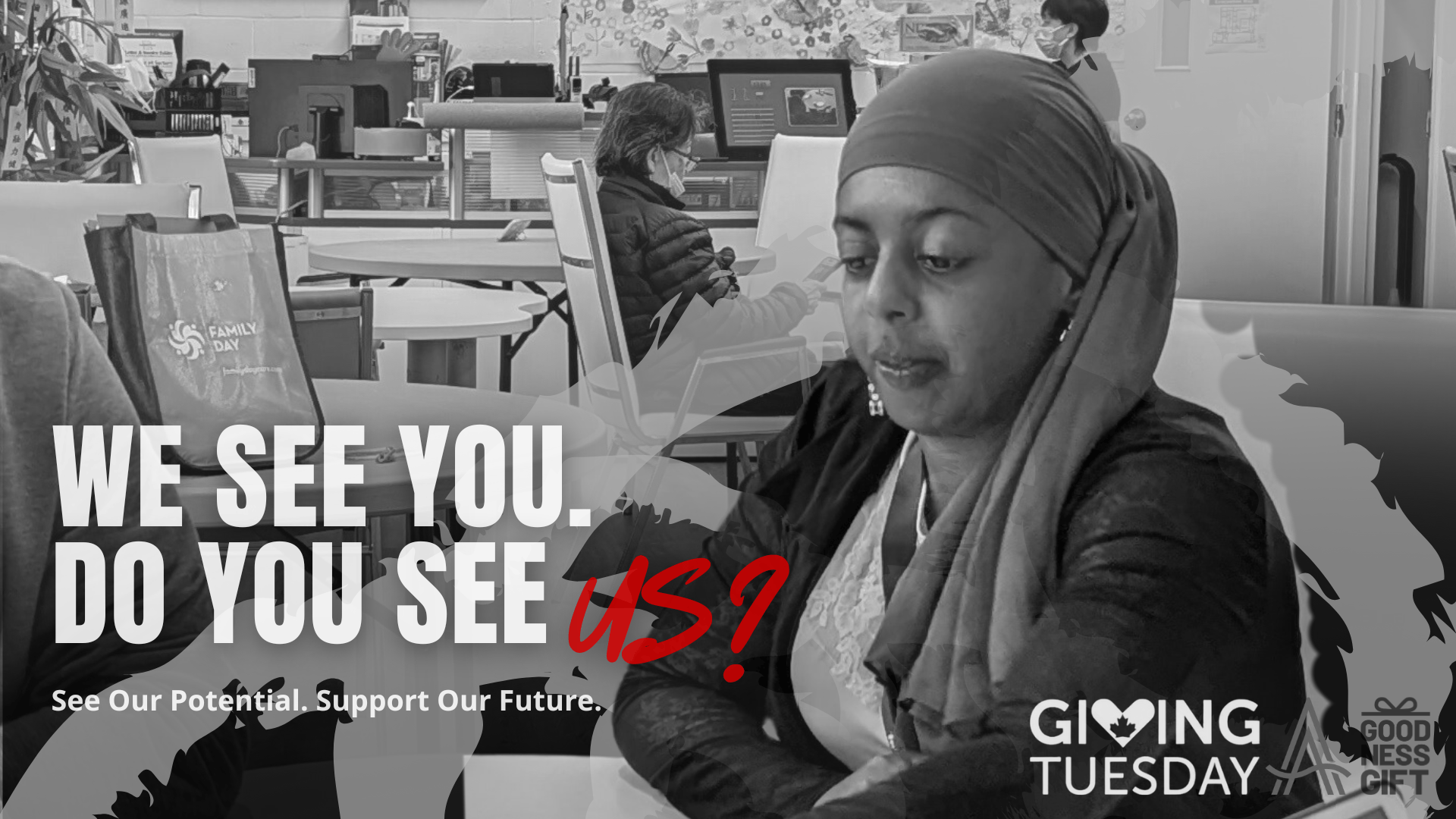 A participant from SAAAC’s Goodness Gift program works attentively at a table, surrounded by others in a community workspace. Text on the image reads “We See You. Do You See Us? See Our Potential. Support Our Future.” with the Giving Tuesday and Goodness Gift logos.