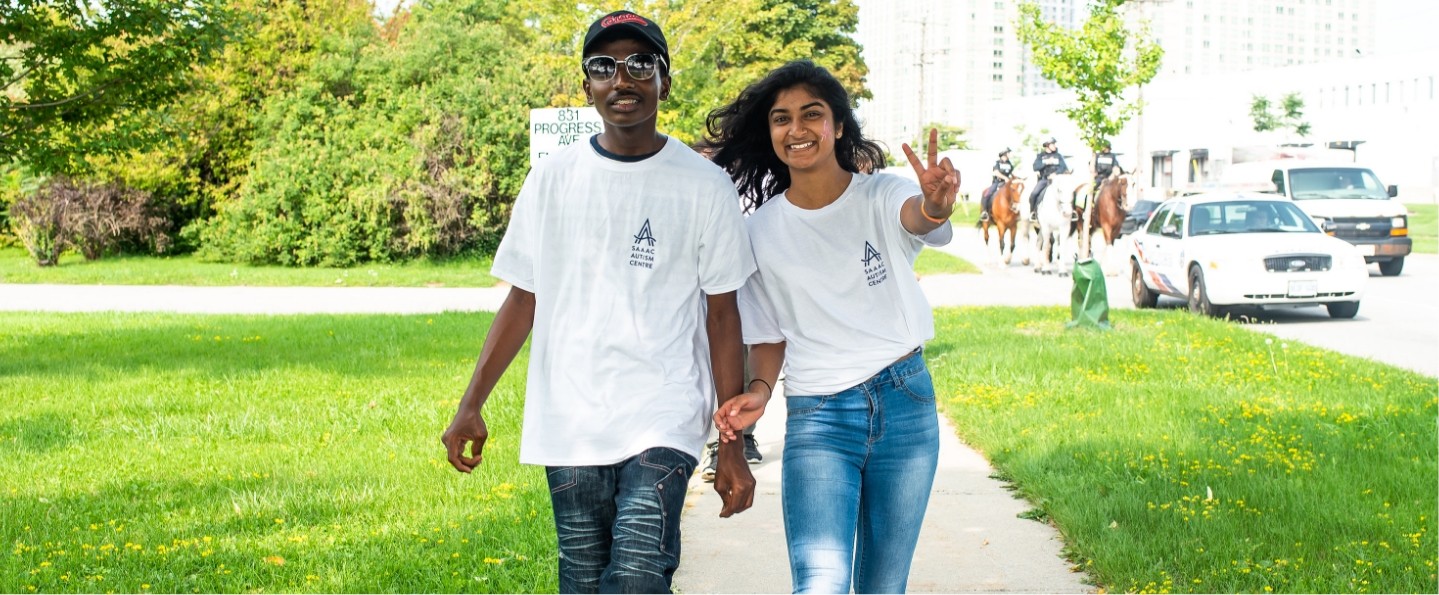 smiling young woman walking with a teenage boy