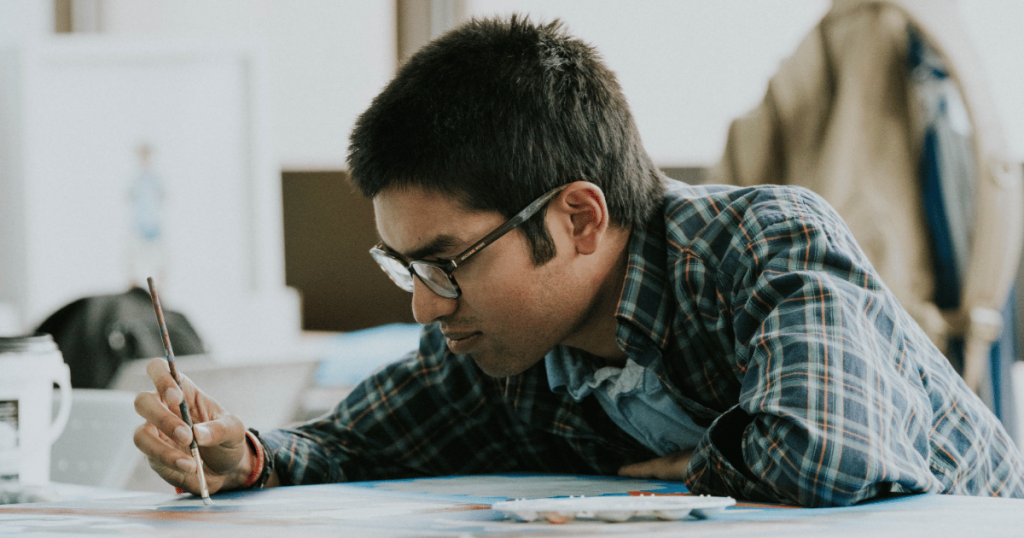 student painting in the saaac autism centre visual arts program.