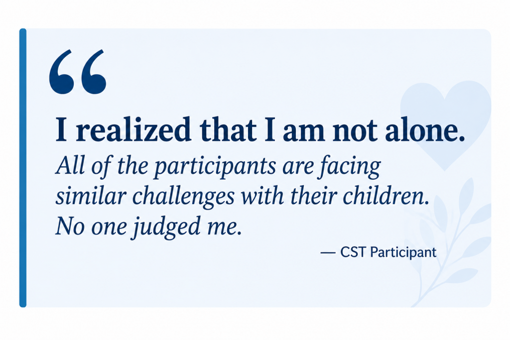 Testimonial graphic featuring a quote from a Caregiver Skills Training (CST) participant. The quote reads: "I realized that I am not alone. All of the participants are facing similar challenges with their children. No one judged me." The quote is displayed on a light blue background with decorative quotation marks and attributed to a CST participant.